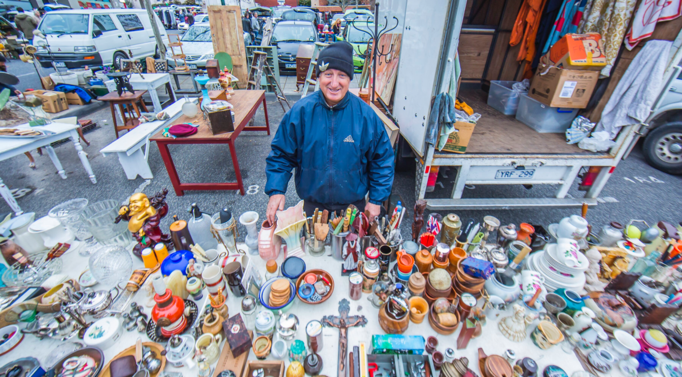 Vendor displaying antique at Camberwell Sunday Market