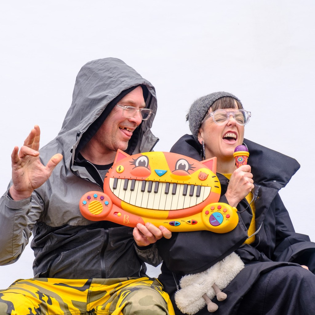 Two market stallholders being happy