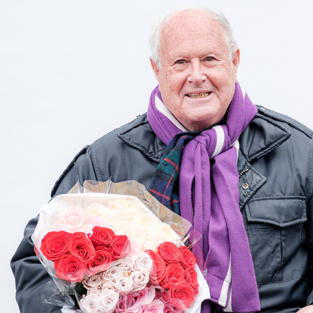 Smiling man with flowers